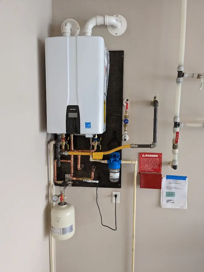 Professional plumber installing copper piping in a El Cerro Mission home